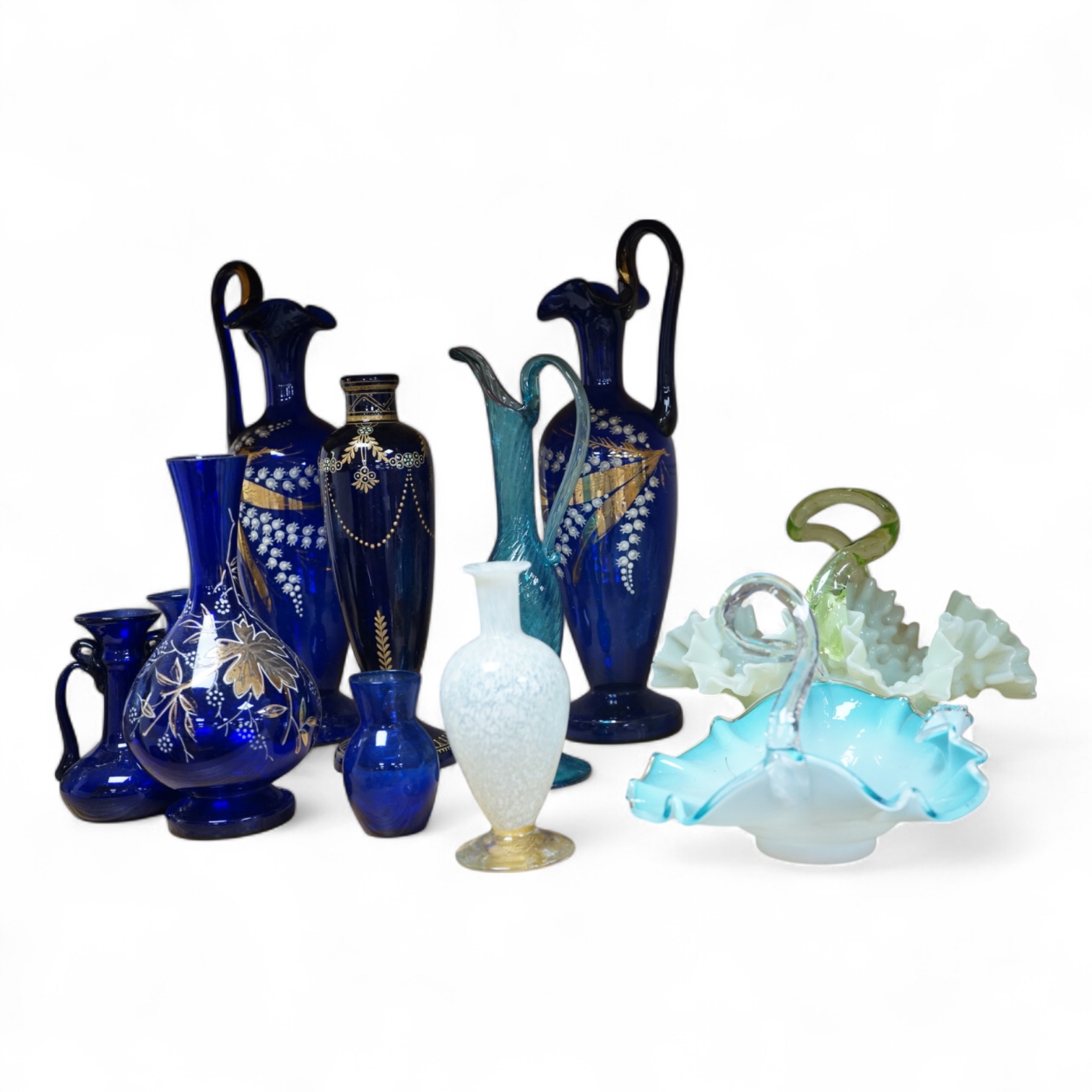 A collection of Bristol blue glassware to include enamel and gilt decanters, together with other glassware, baskets etc, largest 33cm high